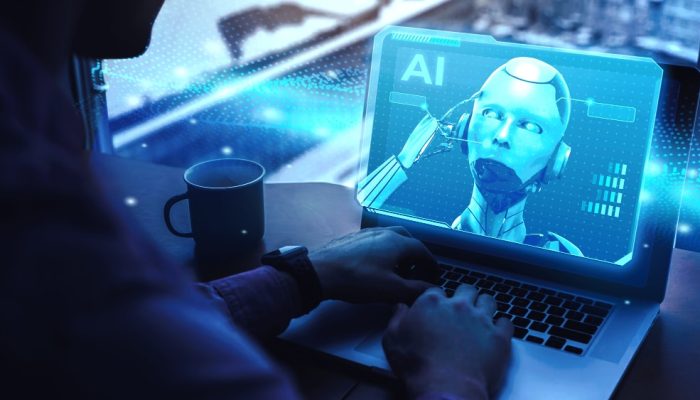 Pessoa olhando laptop com imagem de robô representando inteligência artificial (IA)